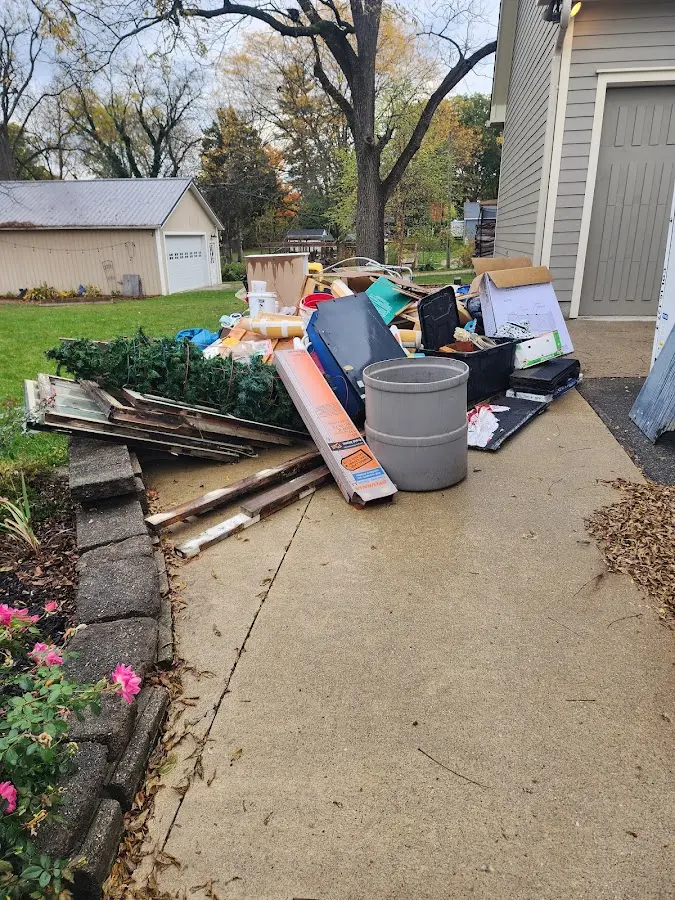 Dumpster being loaded with debris for Estate Cleanout Dumpster Rental in Reading